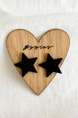 Star button earrings, black